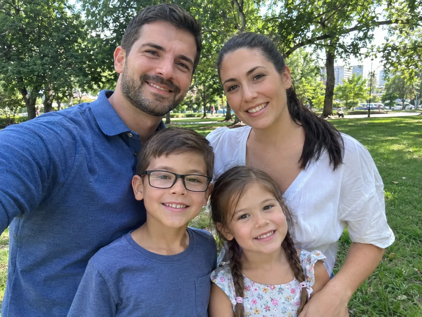 Family of four taking a selfie — Original